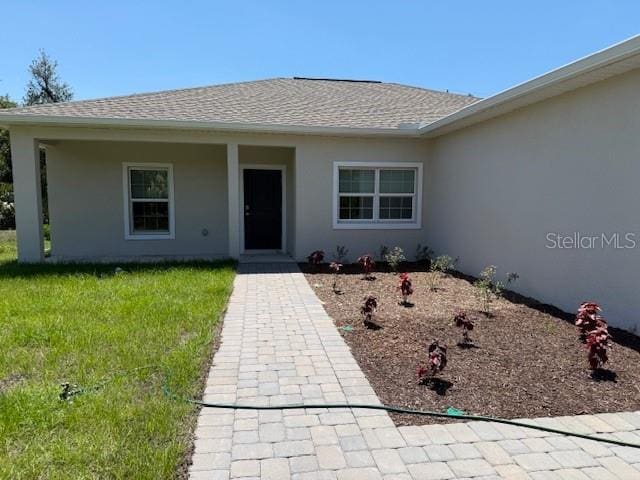 20241 Lorette Ave, Port Charlotte, FL 33954 - view of front of property with roof with shingles and stucco siding