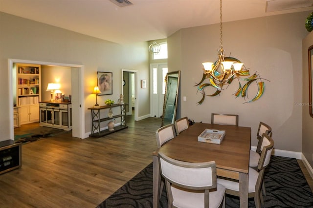 dining area featuring visible vents, baseboards, a chandelier, and dark wood-style flooring
