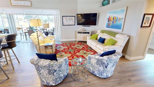 living area featuring wood finished floors and baseboards