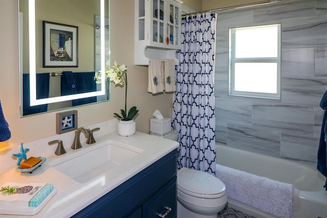 bathroom with toilet, vanity, and shower / bath combo with shower curtain