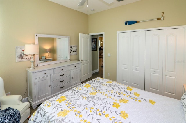 bedroom featuring baseboards, a closet, and ceiling fan