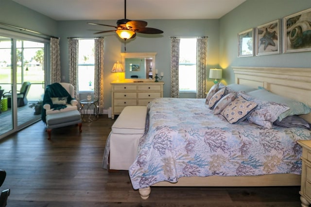 bedroom featuring dark wood finished floors, access to exterior, and ceiling fan