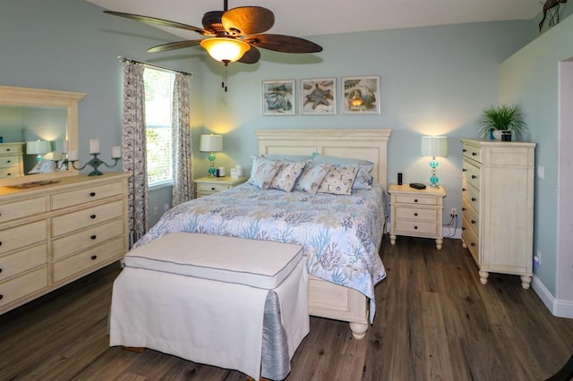 bedroom with ceiling fan, baseboards, and dark wood-style flooring