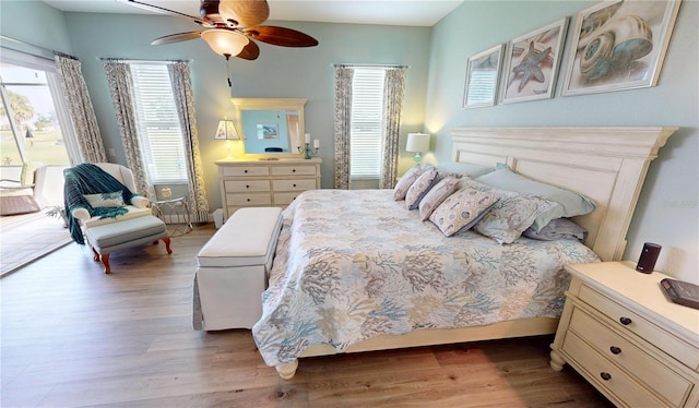 bedroom with a ceiling fan and wood finished floors
