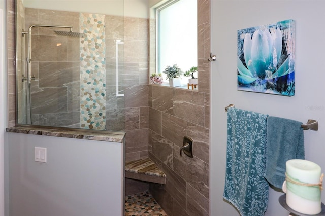 bathroom with a walk in shower