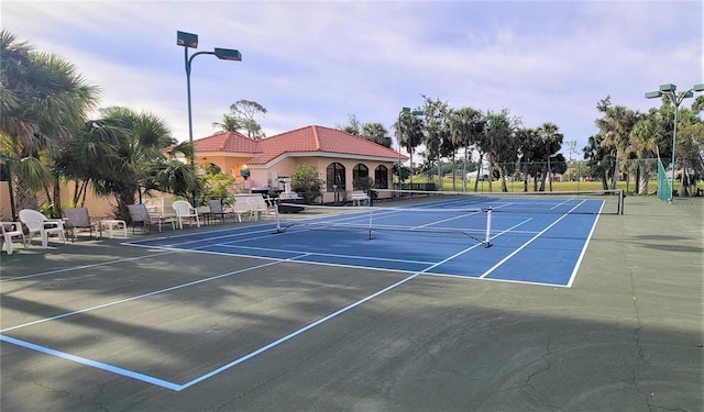 view of sport court featuring community basketball court and fence
