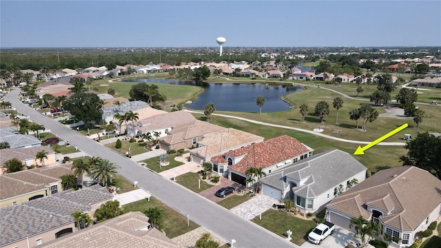 birds eye view of property featuring a residential view and a water view