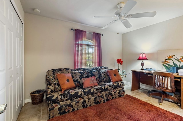 office space with tile patterned floors, ceiling fan, and baseboards