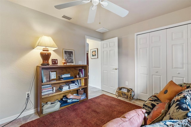 interior space with visible vents, ceiling fan, baseboards, and tile patterned floors