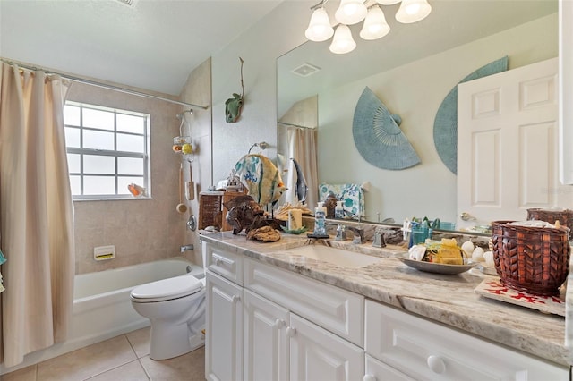 full bathroom with visible vents, toilet, shower / bath combo with shower curtain, vanity, and tile patterned floors