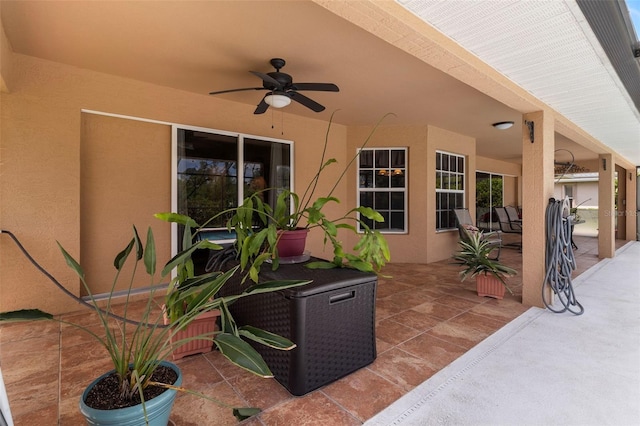 view of patio / terrace with outdoor dining space and a ceiling fan