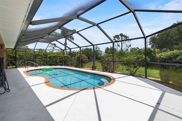 outdoor pool with a patio and a lanai