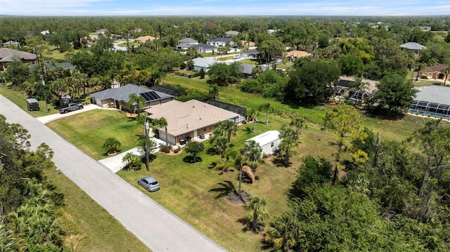 bird's eye view with a forest view and a residential view