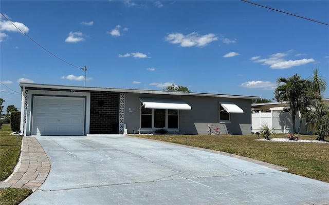 123 Poinsettia Cir NE, Port Charlotte, FL 33952 - single story home featuring an attached garage, concrete driveway, and a front lawn