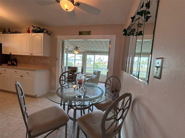 123 Poinsettia Cir NE, Port Charlotte, FL 33952 - dining area featuring ceiling fan, light tile patterned floors, a textured wall, and baseboards