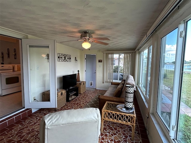 123 Poinsettia Cir NE, Port Charlotte, FL 33952 - living area featuring a ceiling fan, baseboards, and a textured ceiling