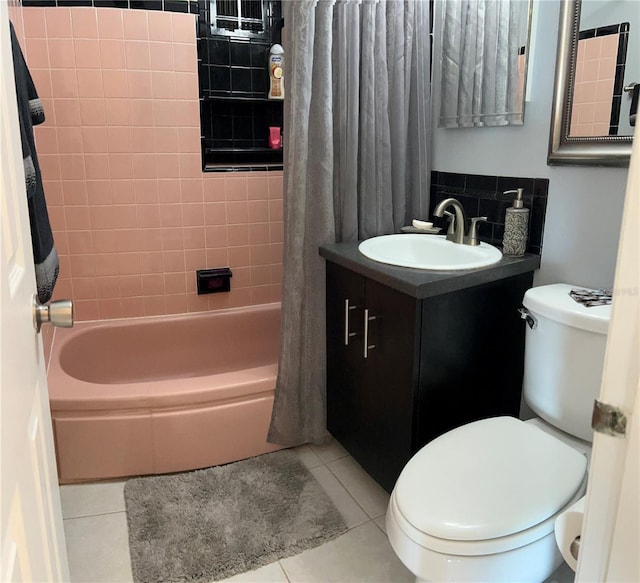 123 Poinsettia Cir NE, Port Charlotte, FL 33952 - bathroom featuring toilet, tile patterned flooring, vanity, and shower / bath combination with curtain