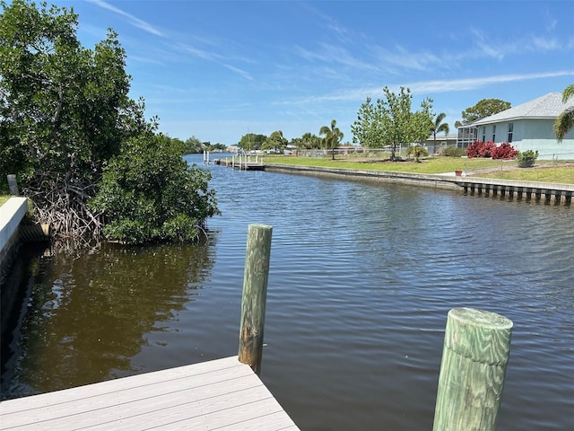 123 Poinsettia Cir NE, Port Charlotte, FL 33952 - dock featuring a water view