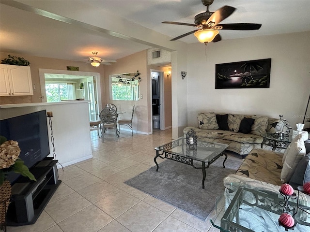 123 Poinsettia Cir NE, Port Charlotte, FL 33952 - living area with a ceiling fan, light tile patterned flooring, and baseboards