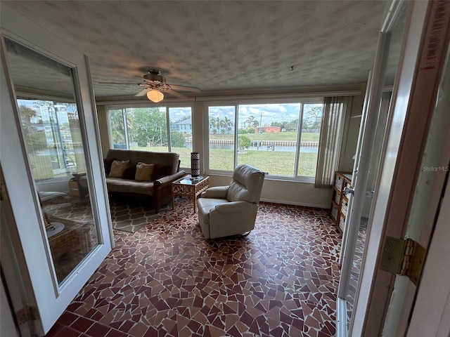 123 Poinsettia Cir NE, Port Charlotte, FL 33952 - sunroom / solarium featuring a water view and stone finish flooring