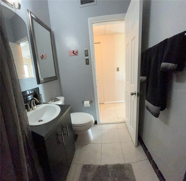 123 Poinsettia Cir NE, Port Charlotte, FL 33952 - bathroom featuring tile patterned floors, vanity, toilet, and baseboards
