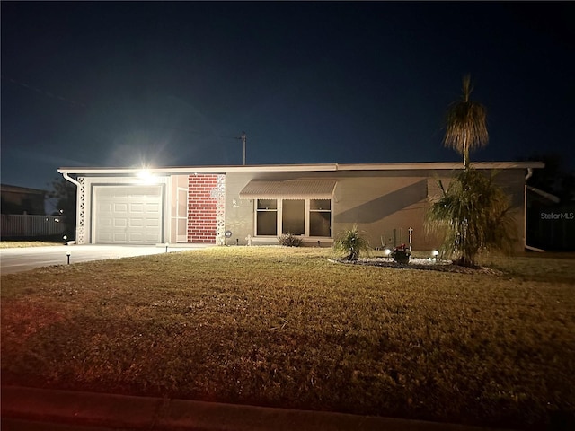123 Poinsettia Cir NE, Port Charlotte, FL 33952 - ranch-style home with concrete driveway, a garage, and a yard