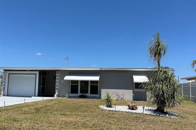 123 Poinsettia Cir NE, Port Charlotte, FL 33952 - view of front facade with an attached garage, a front lawn, and concrete block siding
