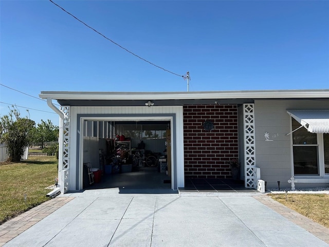 123 Poinsettia Cir NE, Port Charlotte, FL 33952 - garage with concrete driveway