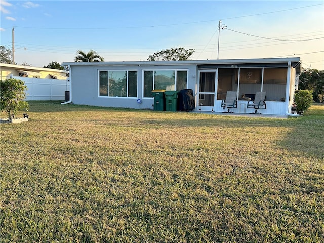 123 Poinsettia Cir NE, Port Charlotte, FL 33952 - rear view of house with a sunroom