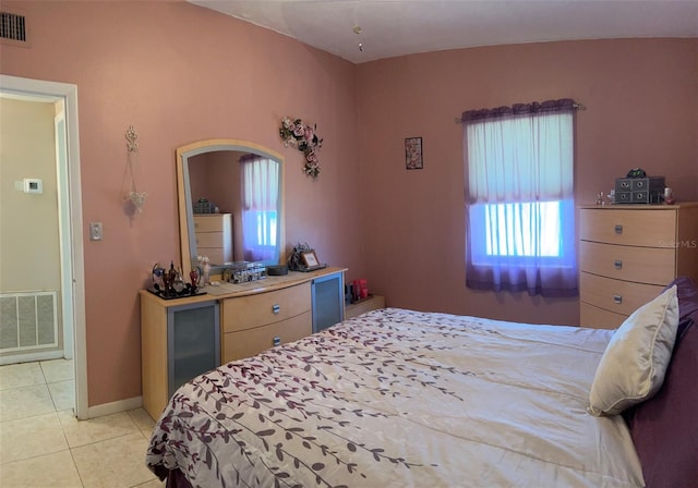 123 Poinsettia Cir NE, Port Charlotte, FL 33952 - bedroom with light tile patterned flooring, arched walkways, and baseboards