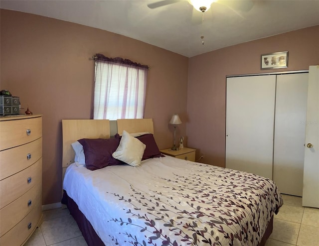 123 Poinsettia Cir NE, Port Charlotte, FL 33952 - bedroom with light tile patterned flooring, a closet, and a ceiling fan