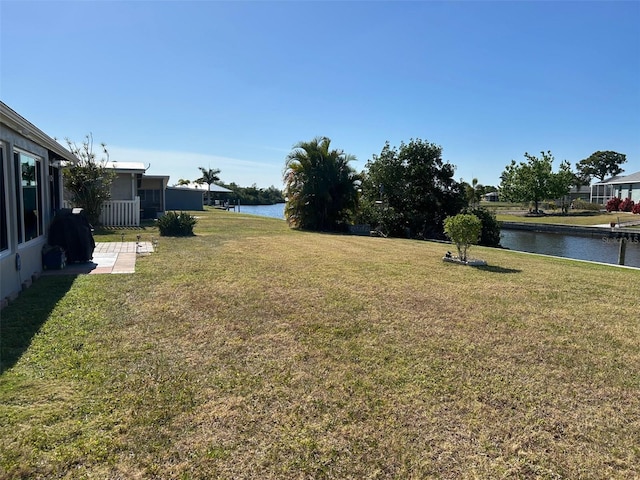 123 Poinsettia Cir NE, Port Charlotte, FL 33952 - view of green lawn with a water view