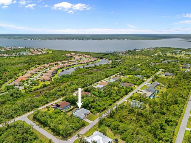 birds eye view of property with a residential view and a water view