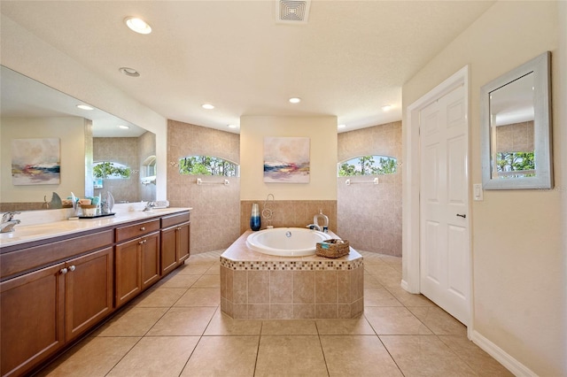 full bathroom with a walk in shower, tile patterned floors, a garden tub, and visible vents
