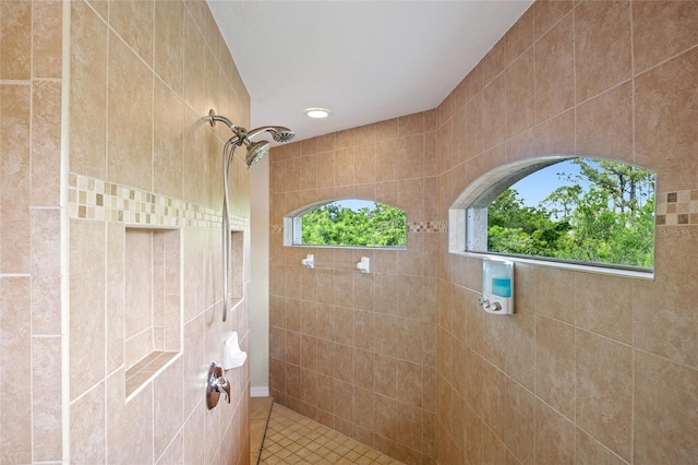 full bath with tile patterned floors and walk in shower