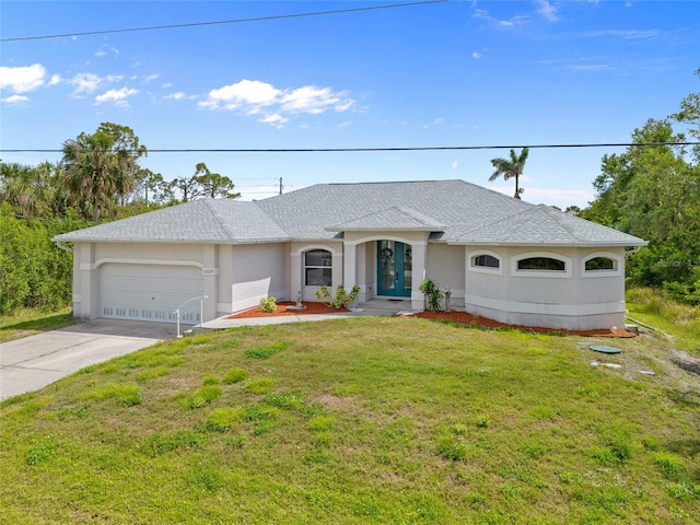 ranch-style home with a front yard, a shingled roof, an attached garage, french doors, and driveway