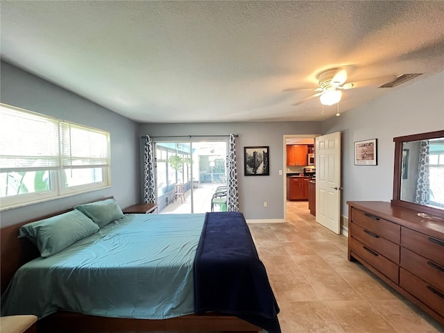 931 Juno Dr, Punta Gorda, FL 33950 - bedroom featuring multiple windows, access to outside, ceiling fan, light tile patterned flooring, and a textured ceiling