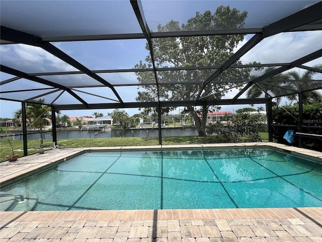 931 Juno Dr, Punta Gorda, FL 33950 - outdoor pool featuring a water view, glass enclosure, and a patio area