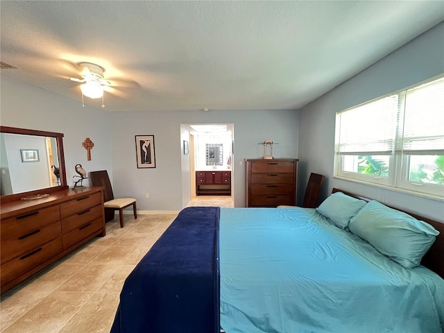 931 Juno Dr, Punta Gorda, FL 33950 - bedroom featuring light tile patterned floors, ensuite bathroom, and a ceiling fan