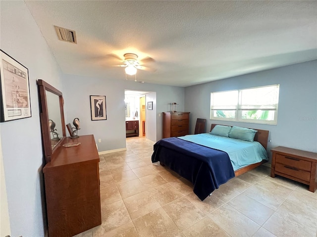 931 Juno Dr, Punta Gorda, FL 33950 - bedroom featuring a textured ceiling, ensuite bath, and a ceiling fan