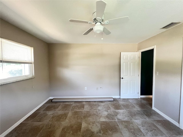 931 Juno Dr, Punta Gorda, FL 33950 - unfurnished room with baseboards and a ceiling fan