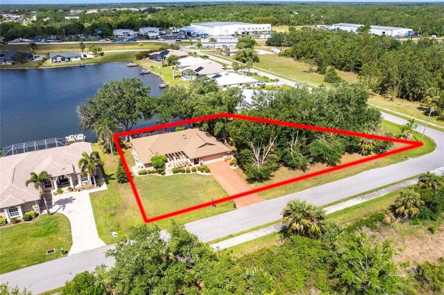 12481 SW Kings Row, Lake Suzy, FL 34269 - aerial view of property and surrounding area featuring a nearby body of water and property boundaries highlighted