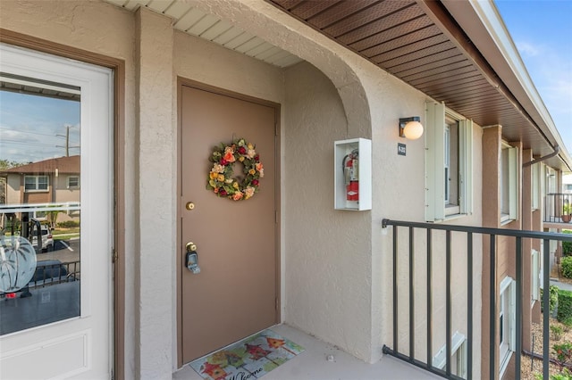 25100 Sandhill Blvd Unit R202, Punta Gorda, FL 33983 - property entrance featuring stucco siding
