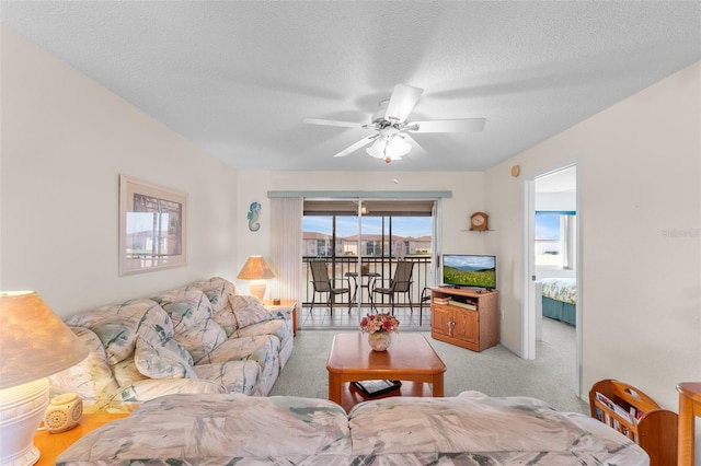 25100 Sandhill Blvd Unit R202, Punta Gorda, FL 33983 - living room with ceiling fan, a textured ceiling, and light colored carpet