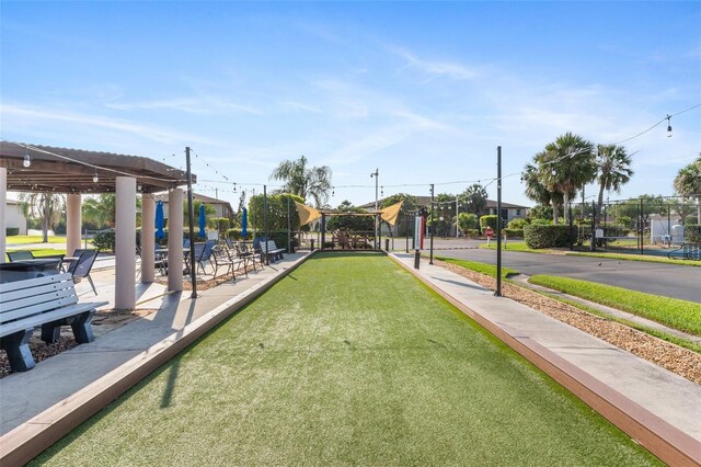 25100 Sandhill Blvd Unit R202, Punta Gorda, FL 33983 - surrounding community featuring a bocce ball area and fence