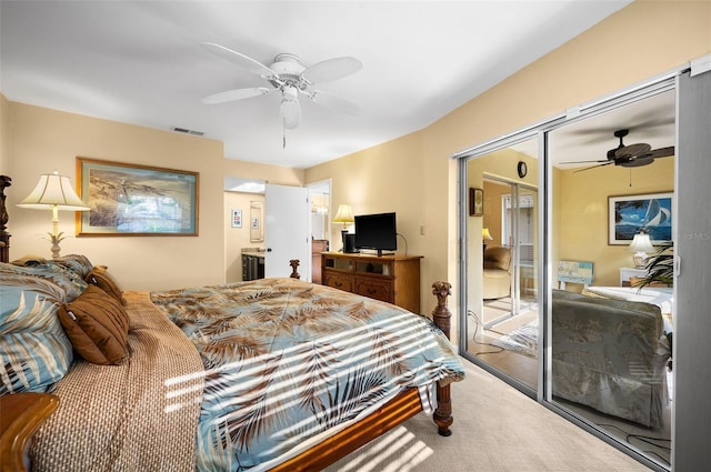 carpeted bedroom with a closet, ceiling fan, and visible vents