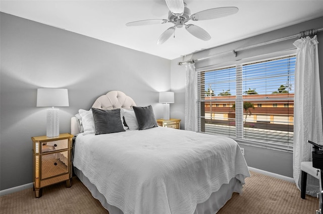 bedroom featuring baseboards, carpet floors, and a ceiling fan