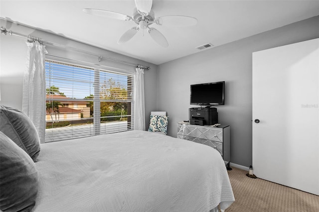 bedroom featuring carpet flooring, a ceiling fan, baseboards, and visible vents