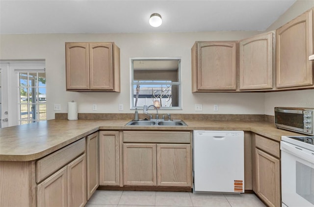 6344 Hera St, Englewood, FL 34224 - kitchen featuring light brown cabinets, dishwasher, a sink, and a peninsula