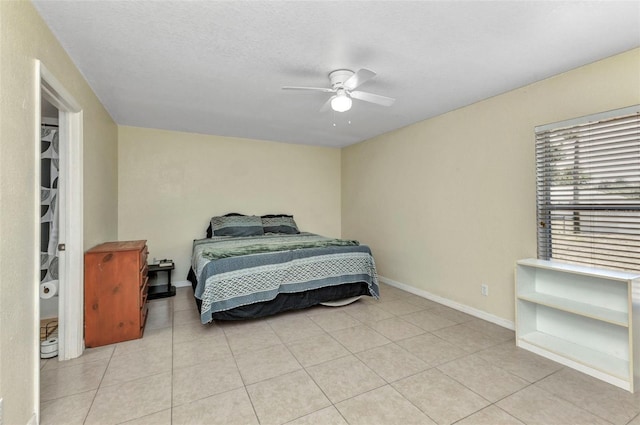 6344 Hera St, Englewood, FL 34224 - bedroom with light tile patterned flooring, a ceiling fan, and baseboards